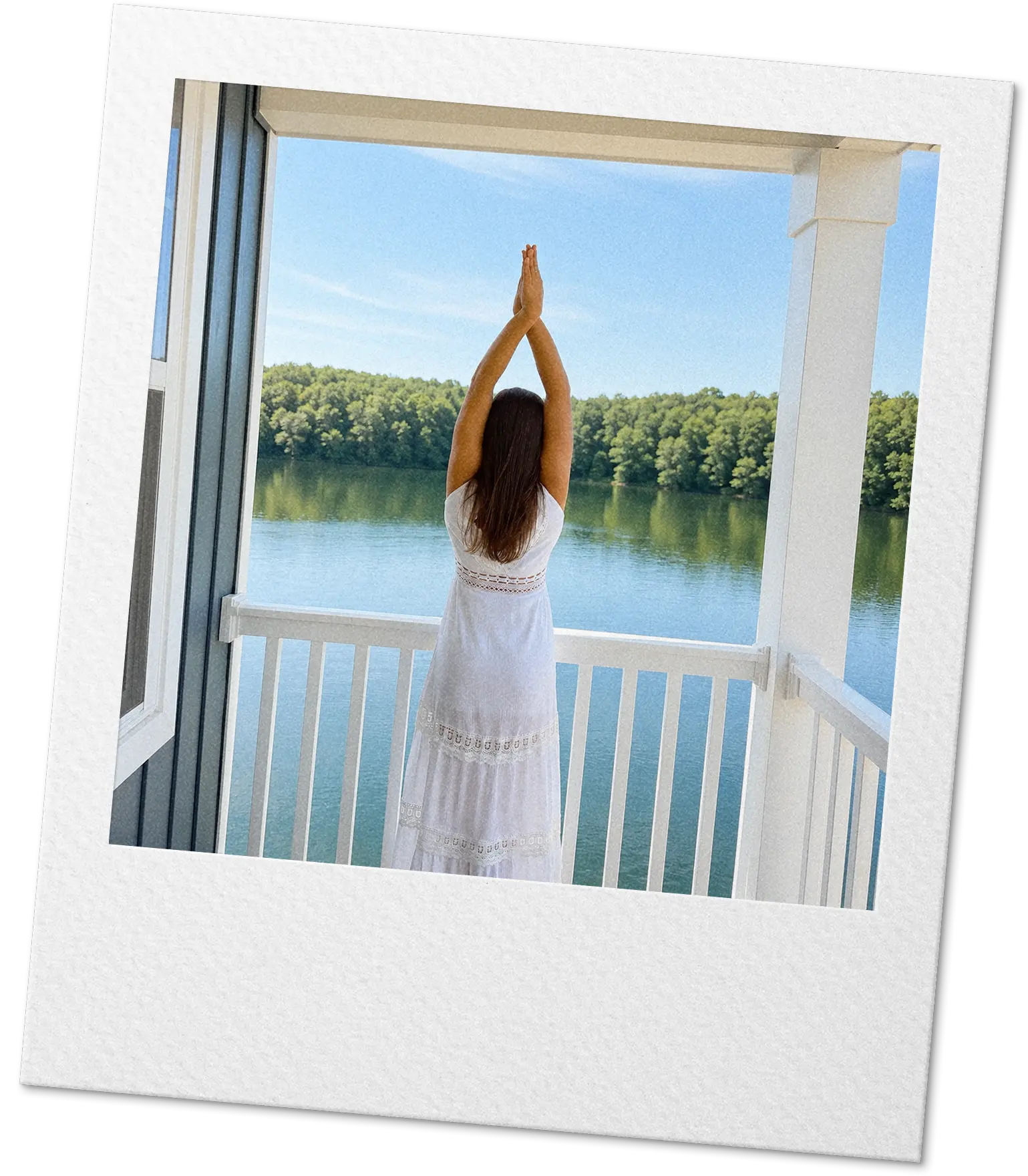 Camila in a yoga pose with her hands raised toward the sky